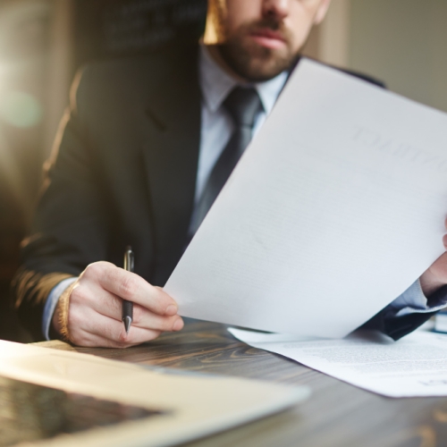 businessman-working-with-documentation-desk